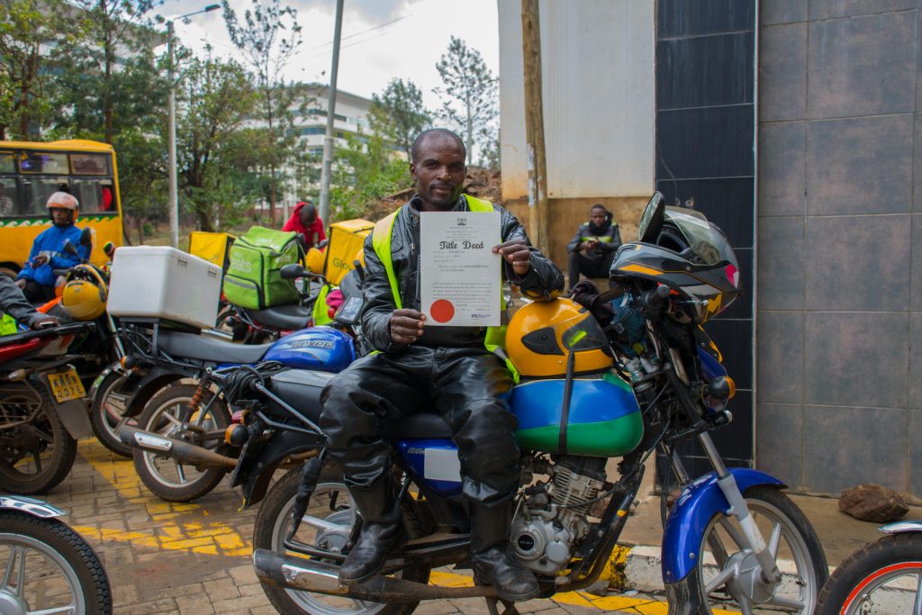 Username Investment Ltd. Client Jared Obara, boda boda operator holding his title deed
