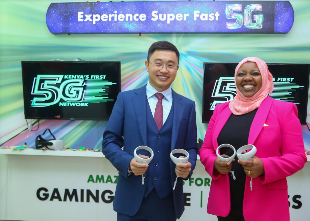 Safaricom Ag. Chief Consumer Business Officer, Fawzia Ali, with Huawei Kenya Deputy CEO, Sheng Kaifu as they sample the 5G enabled gadgets at experiential centre in Village market