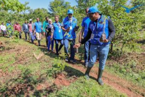 748 Air services MD Moses Mwangi leading his team in tree planting exercise