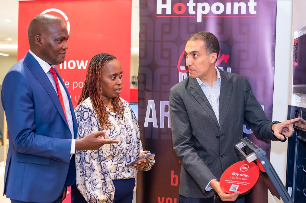 Absa Bank's Customer Network Director Peter Mutua, Head of Card Payments Linda Kimani and Hotpoint's Retail Director Keval Kanani during the launch of the bank's Lipa Pole Pole proposition at Hotpoint's Sarit Outlet.