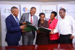 L-R: HFDI Executive Director Joseph Kamau, HF Group CEO Robert Kibaara, Barista Gardens Chairlady Nyokabi Kamau, Directors Wambui Kimani and Kairu Mukunga review Barista Garden’s Brand Book. HF Group’s banking subsidiary HFC has partnered with Kigutha Farmers Limited to add value to the latter’s 58 acres parcel of land in Kamiti Corner, Kiambu County.