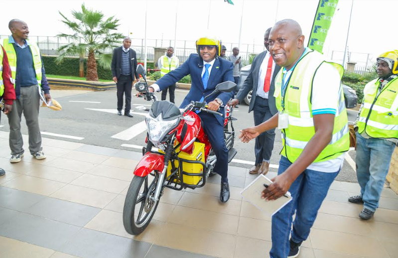 KCB Group CEO, Paul Russo rides one of the new electric motorbikes during the KCB and UNITAR launch of 100,000 Electric Motor Bikes Project launch.