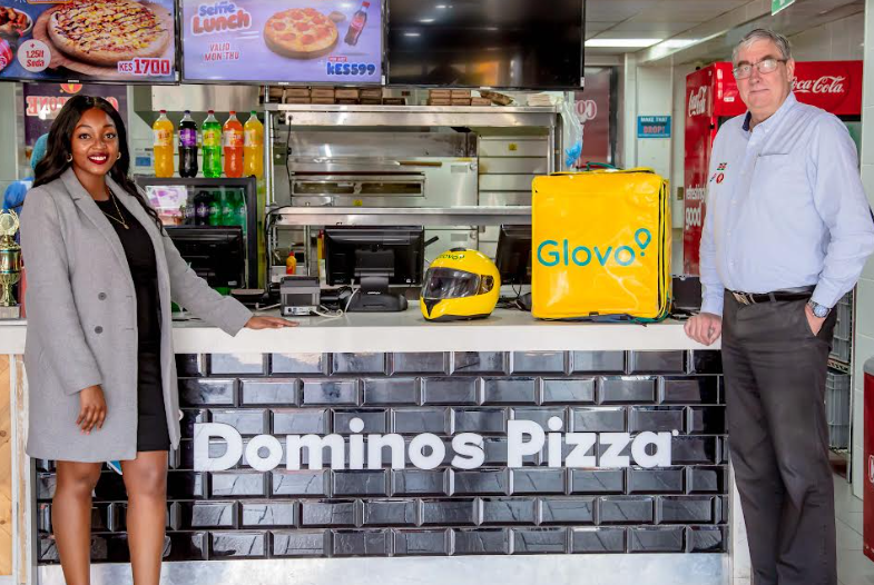 Ivy Maingi, Commercial Manager for Glovo Kenya and Peter Jones, Managing Director, Eat’N’Go Kenya celebrate signing a Memorandum of Understanding to kick off the partnership between Glovo and Domino’s Pizza.
