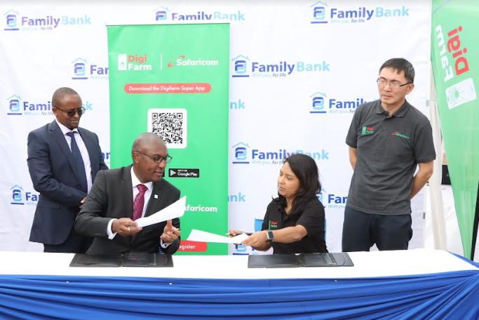 Family Bank Lead Digital Transformation Aristarichus Kuria and Digifarm Director Seema Gohil during the signing of a partnership to provide digital credit to 1000 smallholder farmers in Embu County to boost maize production. Looking on is Family Bank COO John Ndugi and International Food Policy Research Institute Senior Research Fellow Liangzhi You.