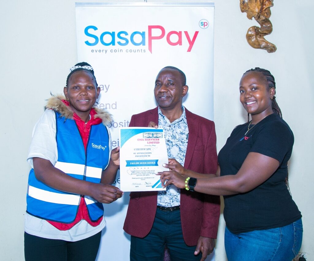 R-L SasaPay Head of Customer Success and Marketing Cathrine Mwihaki, OMA Sacco Chairman George Githinji and OMA conductor Pauline Mueni during the launch of SasaPay Fare Collection Tills, a game-changing cashless payment system designed specifically for the matatu industry.