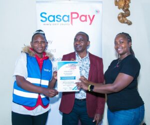 R-L SasaPay Head of Customer Success and Marketing Cathrine Mwihaki, OMA Sacco Chairman George Githinji and OMA conductor Pauline Mueni during the launch of SasaPay Fare Collection Tills, a game-changing cashless payment system designed specifically for the matatu industry.