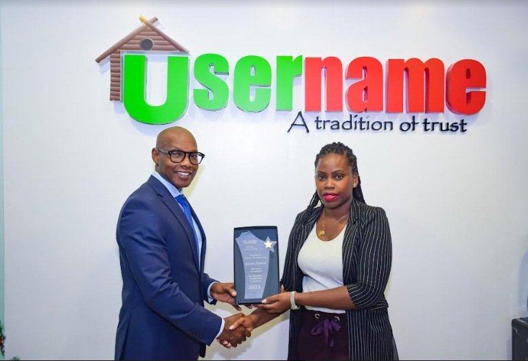Reuben Kimani, CEO Username Investments (centre) receiving an award as a Kenyan Changemaker by TUKO Business Leaders Award from Julia Majale, Managing Director TUKO