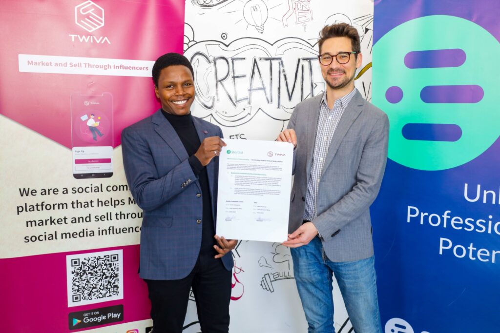 Peter Kironji, CEO & Co-founder at Twiva, left, holding the partnership agreement with Austen Stranaham, COO at Shortlist