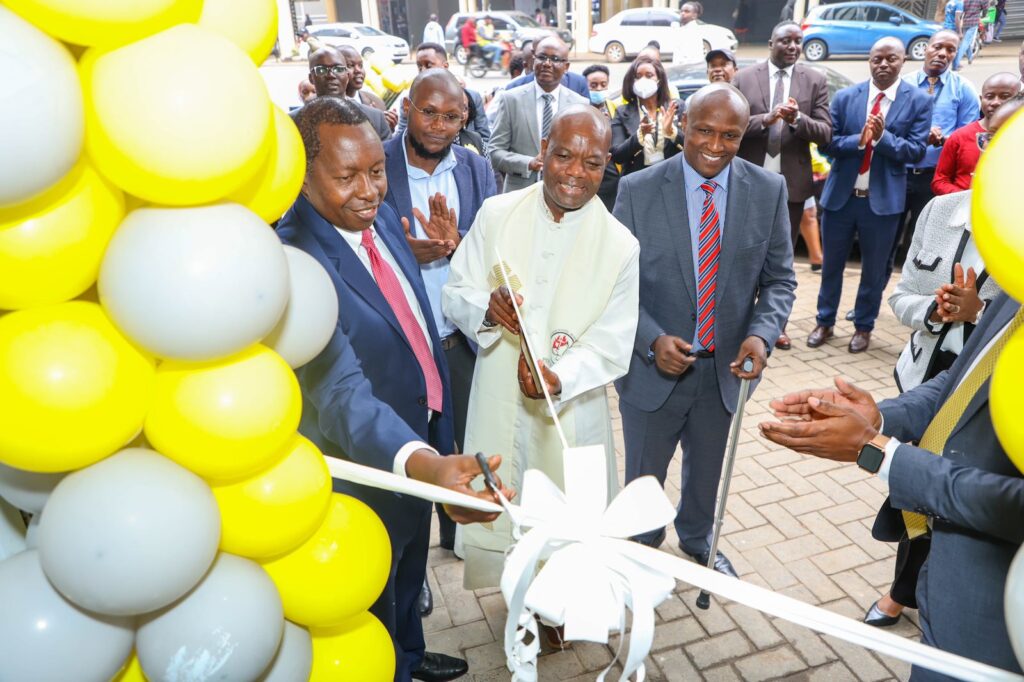 From Left Chief Executive Officer Sidian Bank Mr Chege Thumbi, Father Julius Morara , Director Strategy and Finance Mr Douglas Mwangi at the branch opening yesterday.