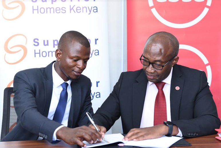 Superior Homes Kenya Head of Sales Clive Ndege and Absa Bank Regional Manager and Head of Mortgage Retail and Business Banking John Kaburu sign a mortgage financing deal that will enable home buyers to enjoy 90 percent financing with an extended loan repayment period of up to 25 years.