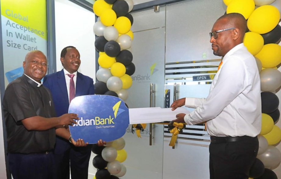 Rev. Vicar General, ArchDiocese of Mombasa Fr. Amogust Mdawida , Chief Executive Officer Sidian Bank Mr Chege Thumbi and Erastus Minyori, Branch Manager – Nyali branch at the branch opening of Sidian Branch Nyali in Mombasa County.