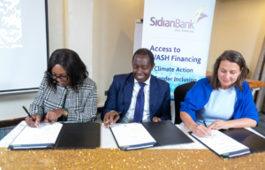 From Left,Josien Slujjs MD Aqua for All, Ms Caroline Mulwa Africa Regional Director Oikocredit and Mr Chege Thumbi Sidian Bank CEO during the signing ceremony at Sarova Panafric Hotel in Nairobi