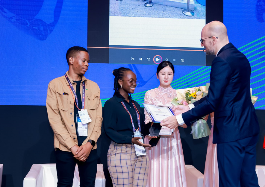 Sylvia Kipkemoi (centre) receives her award after she emerged as the second-best student in Huawei’s Africa digital creation contest in Shanghai, China last week