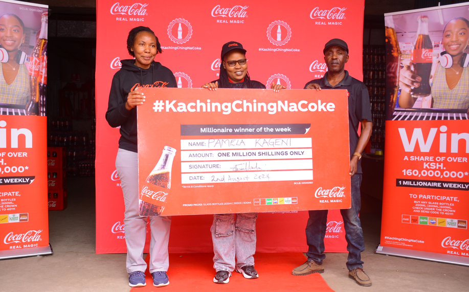 (L-R) Regional Trade Marketing Manager Nairobi, Coca- Cola Bottlers Kenya, Shilah Shitanda, Ksh 1Million winner Pamela Kageni from Nairobi and Area Sales Manager, Eastleigh District, Coca-Cola Bottlers Kenya, Ben Momanyi during the presentation of a cheque to one of the winners of the Kachingching na Coke campaign.