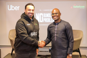 Imran Manji- Head of East and South Africa Uber (Left) and Bernard Muteti - Enterprise Solutions Director Safaricom (Right) shaking hands during the partnership announcement between Safaricom and Uber to provide free data for drivers and riders in Kenya.