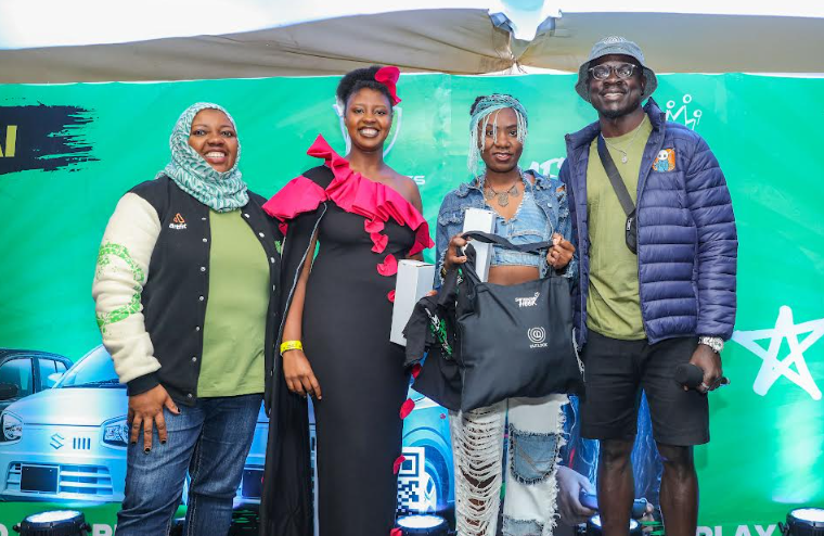 (Left)Fawzia Ali, Chief Business Consumer, Safaricom PLC gifting S-Hook fashion category winner Cynthia Tame (right) alongside fashion mentor (furthest right) OJ (outlook) during the S-Hook Praktiklz Event at Nakuru Athletics Club on Saturday 16 th November, 2024.