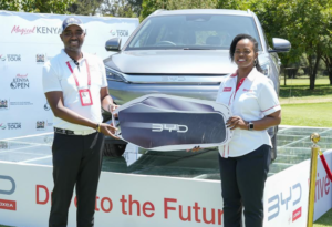 Ronald Kibaara Meru - Magical Kenya Open Commercial Director (left) and Loxea by CFAO Managing Director, Jennifer Kinyoe during the handover of the BYD Atto 3 electric vehicle which will be the hole-in-one prize during the Magical Kenya Open Golf Tournament currently taking place at Muthaiga Golf Club.