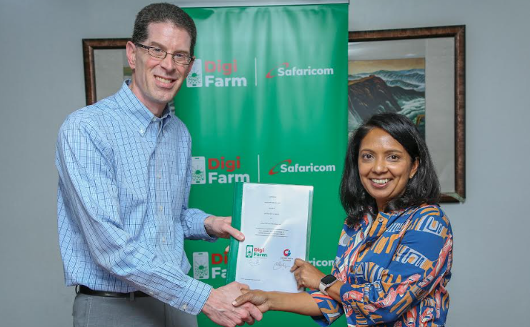 Seema Cohil(R) Director Digi farm Safaricom with Greg Nelson (L)Chief Technology Officer Opportunity International, pose for a photo during the signing of an MOU for the provision of advisory services to Digi farm farmers across Africa. The event took place at Safaricom HQ in Nairobi.