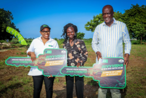 KCB Director of Mortgage Business Caroline Wanjeri (left), Revvvisha grand prize winner and Kitale-based business lady Joan Cheruto (center), and Kilifi Governor H.E. Gideon Maitha Mung'aro (right) pose with keys after awarding Cheruto a KShs. 3 million plot at Kingswood Park Estate, Vipingo, as part of the Revvvisha na KCB campaign.