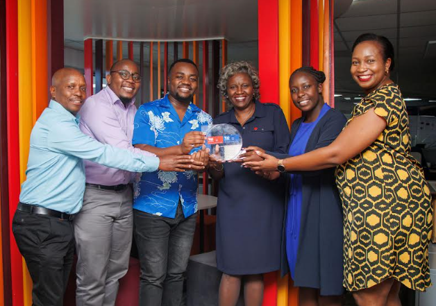 Absa Bank Kenya Chief People Officer Mumbi Kahindo (3rd from right) leads the Absa team in receiving the Top Employer Award for the fifth year running.