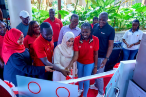 Absa Bank Kenya Coast Regional Manager Fathiya Noordean (Left), Customer Network & Distribution Director Peter Mutua (Right) and the bank’s customers during the official launch of a Sales & Service Pod at Nyali Bazaar Mall, its second such facility in the country